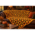 Vintage 1970s orange brown and yellow granny square crochet afghan